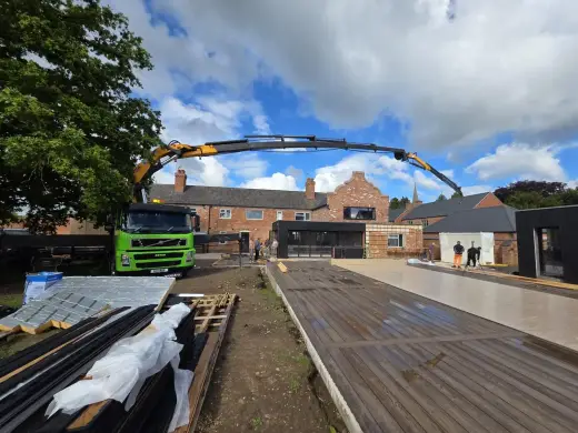 HIAB lorry lifting materials on a housing development