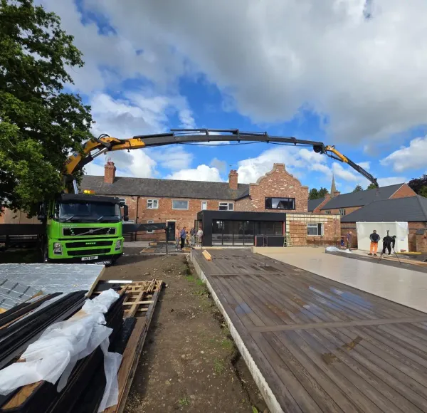 HIAB lorry delivering materials to a housing development