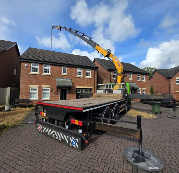 HIAB crane lorry lifting on a new housing estate
