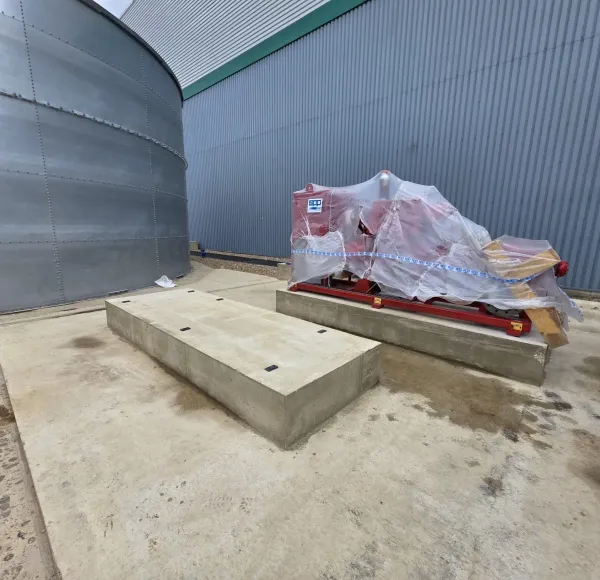 Machinery placed on a concrete plinth at an industrial site