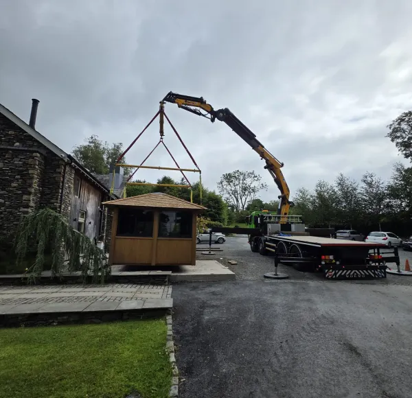 HIAB crane lifting a timber gazebo