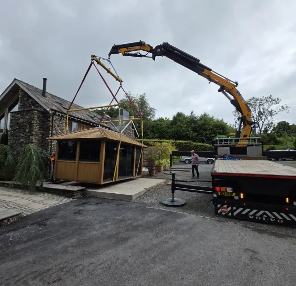 HIAB crane positioning a timber gazebo