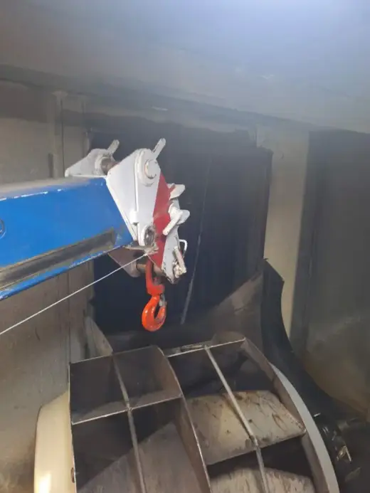 Crane hook lifting an industrial fan housing