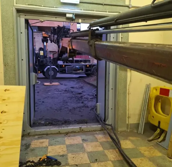 Machinery being removed through a doorway