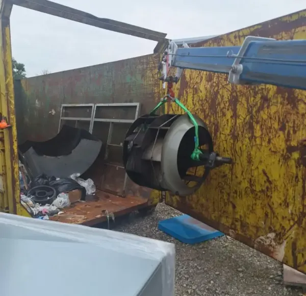 Removed machinery placed inside a skip