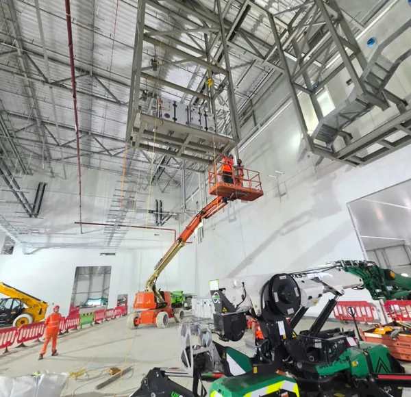 Spider crane installing plant inside a building