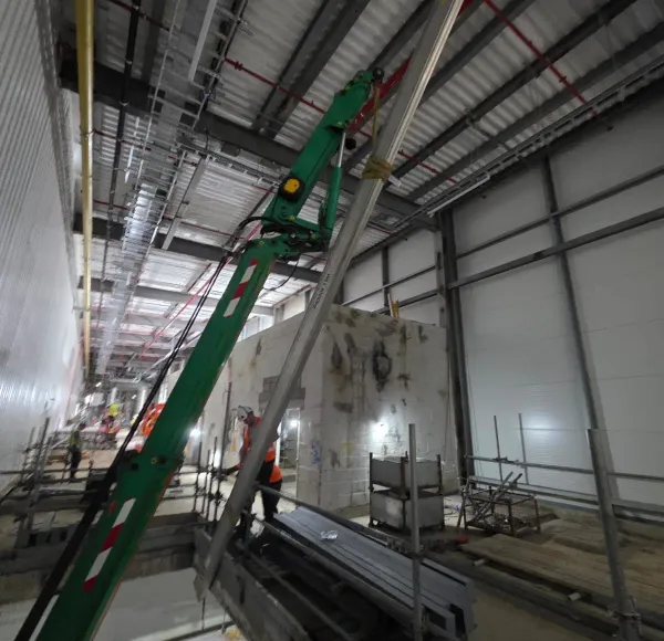 Spider crane lifting through a building void