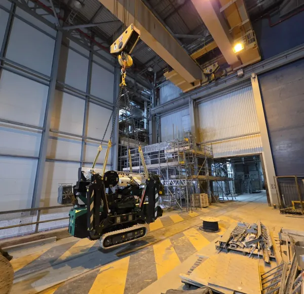 Spider crane working inside a building under construction