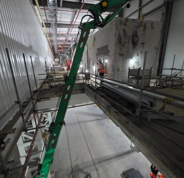Spider crane operating inside a plant room