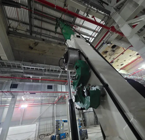 Spider crane lifting inside a factory