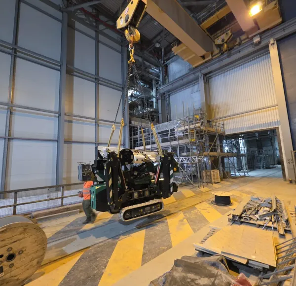 Spider crane on a raised platform inside a building