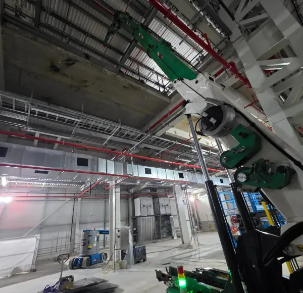 Spider crane working inside an industrial unit