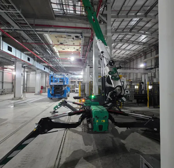 Spider crane boom inside a tall building